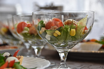 Fresh salad in glass cups on a buffet table