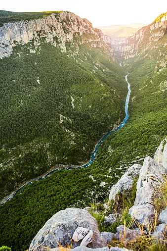 Aerial View of Verdant Mountain Gorge with Winding River