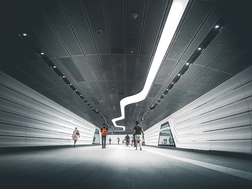 Modern Futuristic Tunnel with People Walking