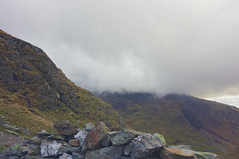 Misty Mountain Highland Landscape with Foreground Rocks