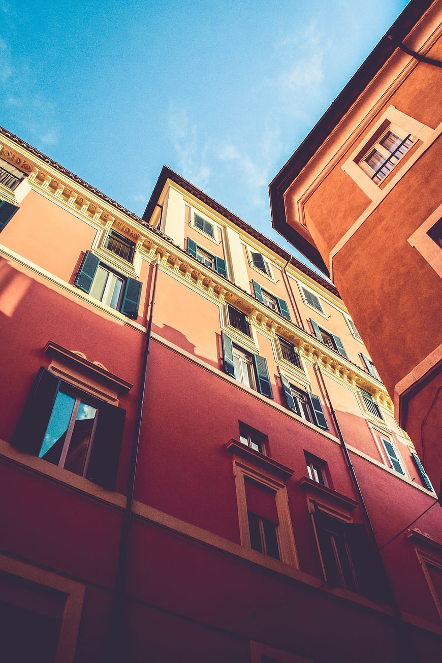 Low angle view of colorful European buildings against blue sky