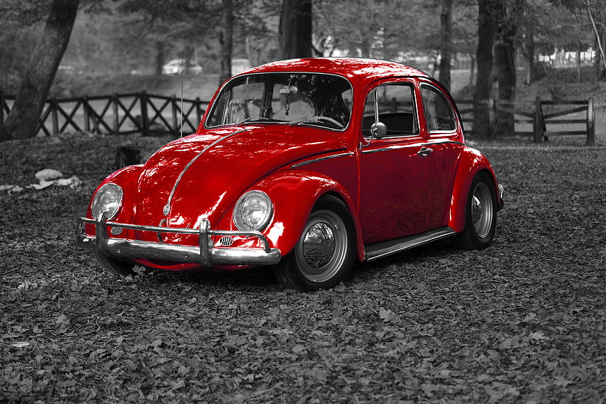 Red Vintage Volkswagen Beetle in Autumn Park
