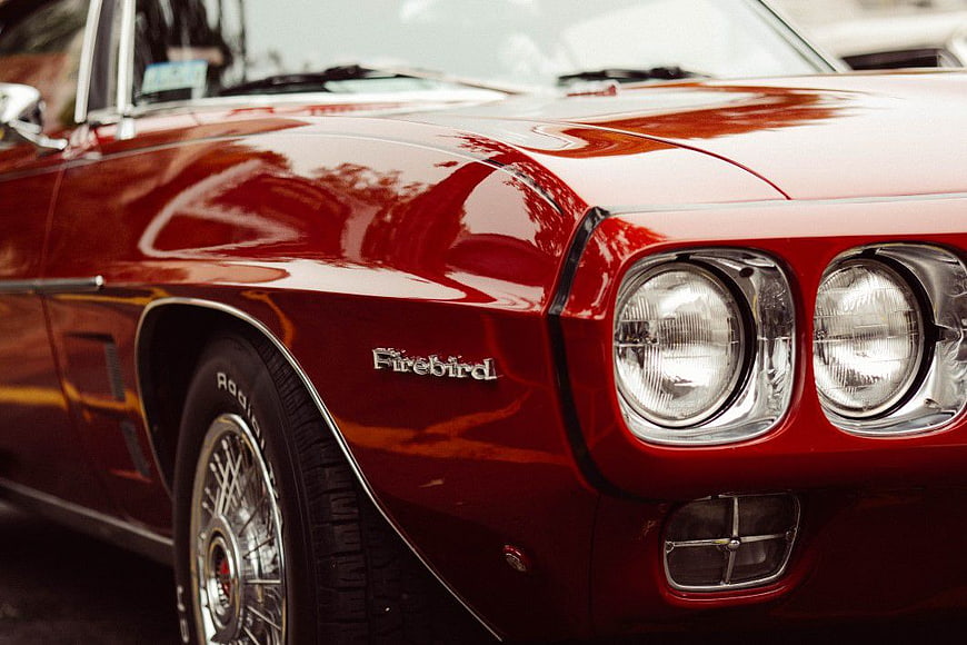 Close-up of Classic Red Pontiac Firebird Front Fender