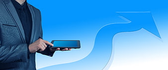 Businessman holding tablet with upward growth arrow on blue background
