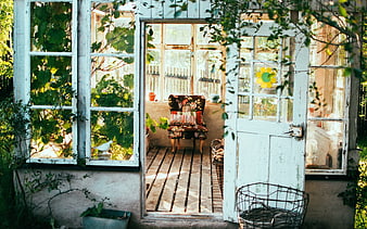 Rustic Garden Room with Vintage Floral Chair and Sunlight