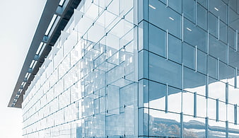 Modern Glass Office Building Facade with Blue Tint
