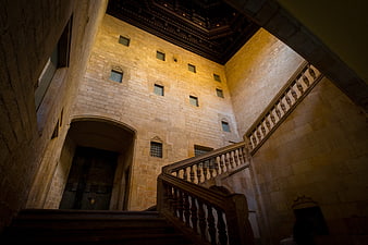 Low angle view of historic stone staircase and courtyard