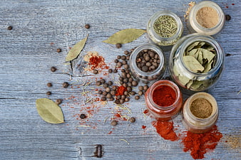 Top View of Assorted Spices and Herbs on Blue Wood