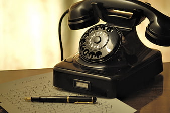 Vintage Black Rotary Phone with Pen and Handwritten Letter