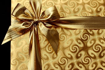 Gold Gift Box with Ribbon and Swirl Pattern