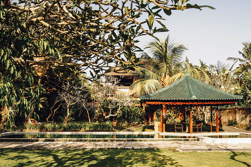 Tropical Bali Villa Pool with Traditional Gazebo and Lush Garden