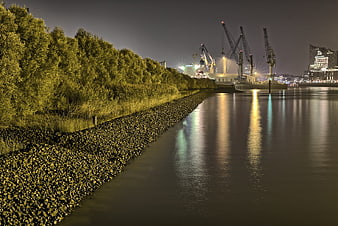 Night view of Hamburg port cranes and Elbphilharmonie