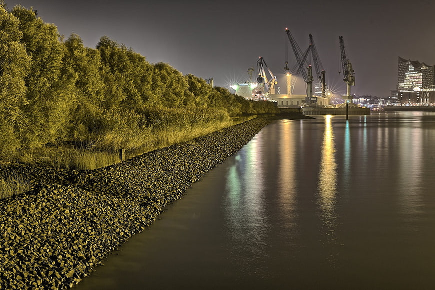 Night view of Hamburg port cranes and Elbphilharmonie