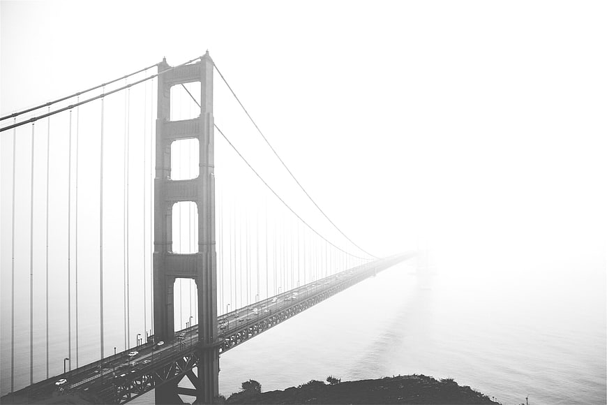 Golden Gate Bridge in thick fog black and white