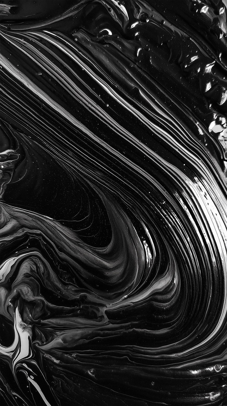 Abstract black and white swirling liquid texture background