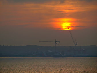 Industrial Harbor Sunset with Cranes Silhouette