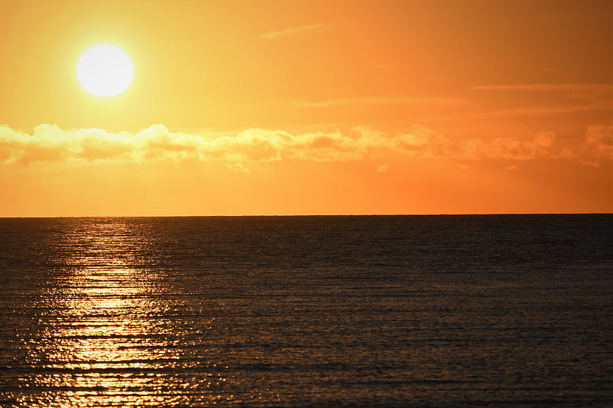 Golden Sunset Over Calm Ocean Horizon