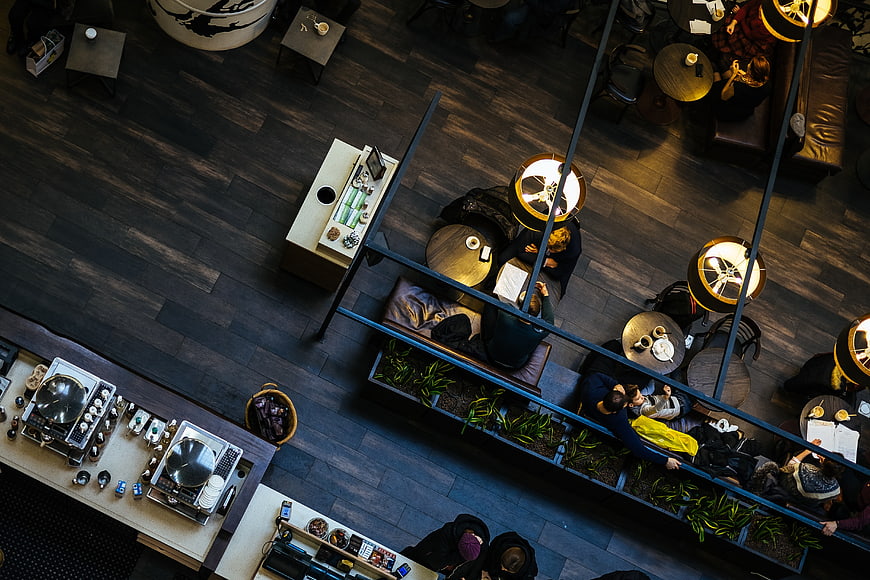 Overhead view of modern coffee shop interior with customers