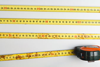 Yellow Measuring Tape on White Background