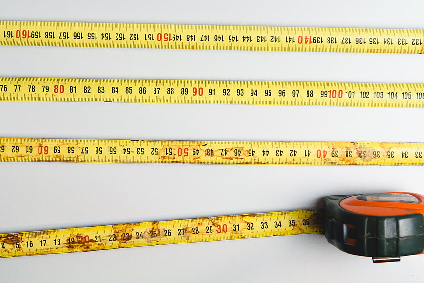 Yellow Measuring Tape on White Background