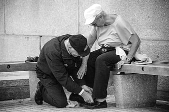 Senior couple sharing a tender moment on a bench