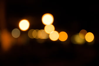Abstract warm bokeh lights on dark background