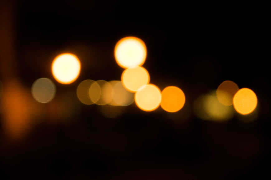 Abstract warm bokeh lights on dark background