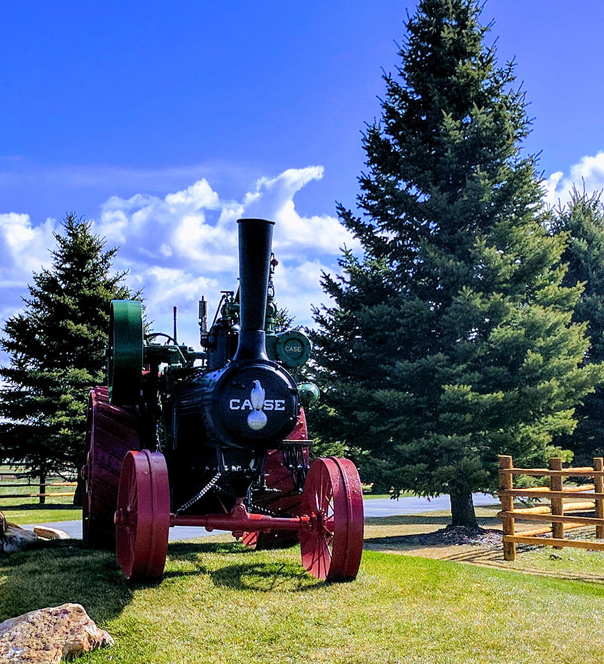 Vintage Case Steam Traction Engine in Rural Setting