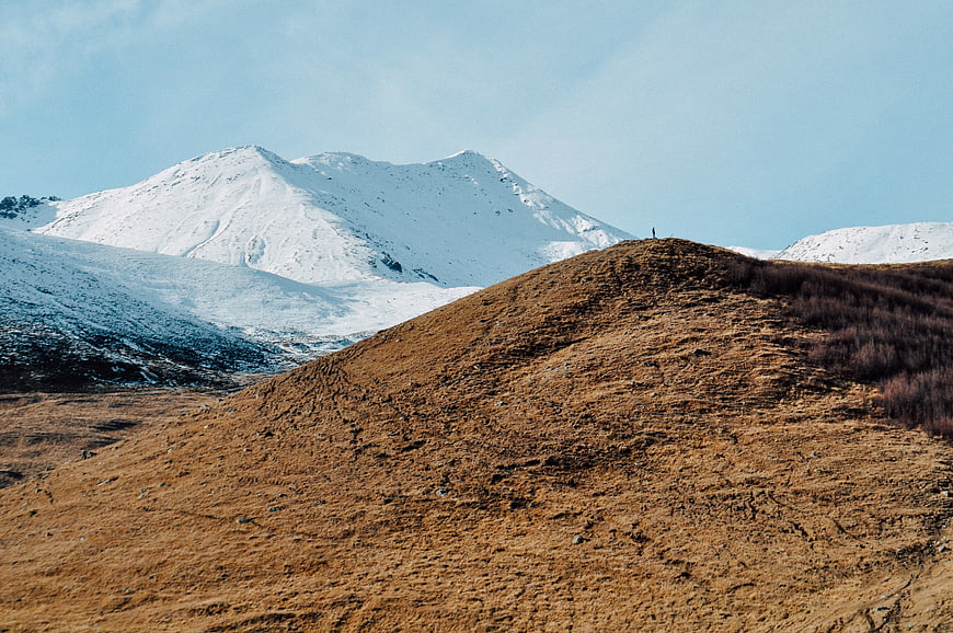 Snowy Mountain Peak with Brown Highland Foreground