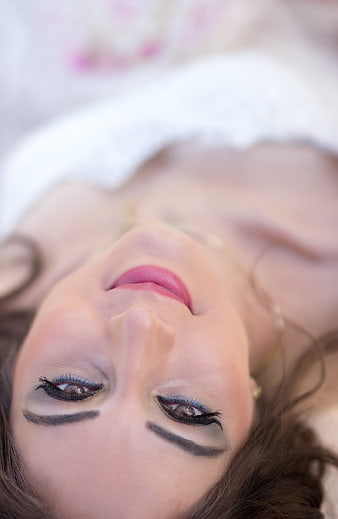 Upside down close-up portrait of a bride with makeup