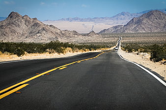 Scenic Desert Highway Stretching Through Arid Mountainous Landscape