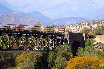 Old rusty railway bridge in Combarbalá valley landscape