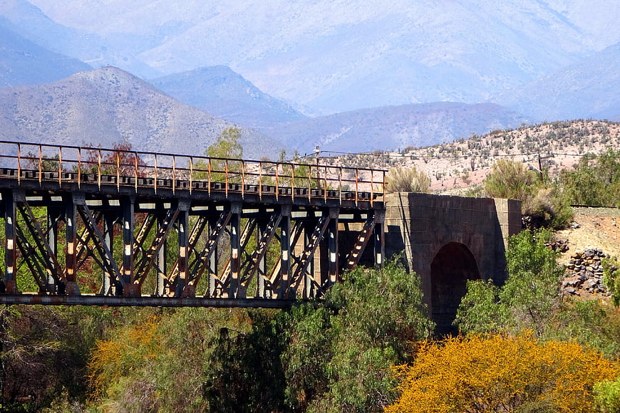 Old rusty railway bridge in Combarbalá valley landscape