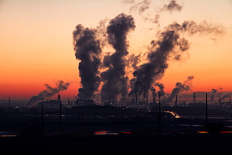 Industrial Pollution Smokestacks at Sunset