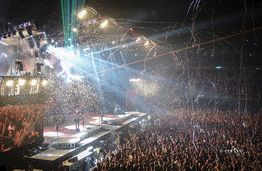 Live Concert Crowd with Confetti and Stage Lights