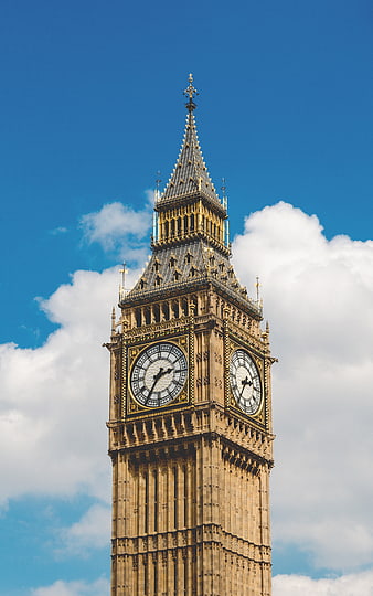 Big Ben Clock Tower Against Blue Sky and Clouds