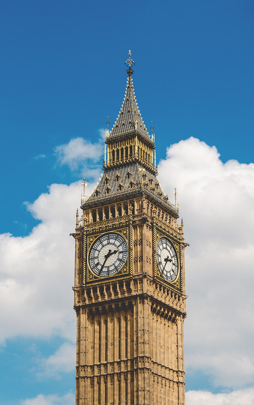 Big Ben Clock Tower Against Blue Sky and Clouds