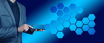 Businessman touching tablet with glowing blue hexagonal network pattern