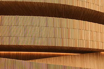 Modern wooden slat architecture with warm lighting