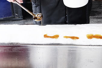 Pouring Maple Syrup on Snow for Ice Candy