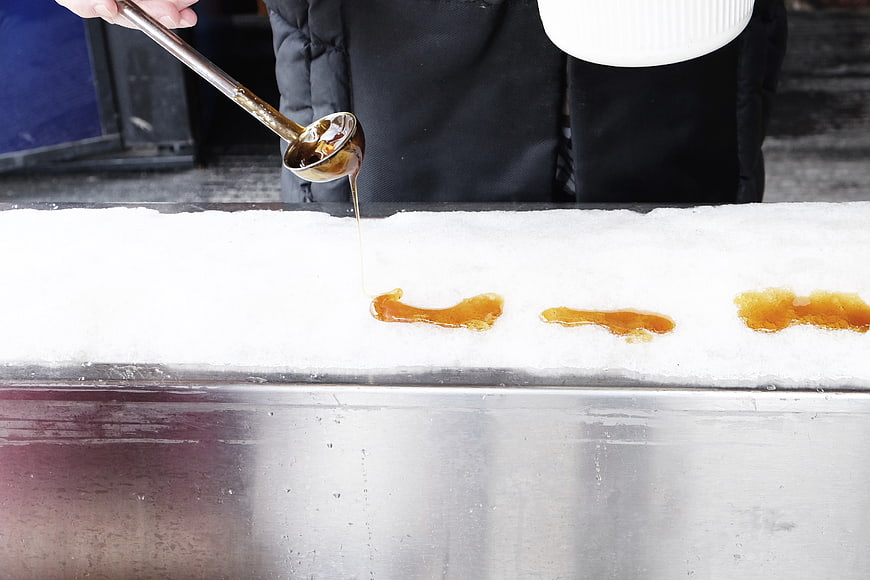 Pouring Maple Syrup on Snow for Ice Candy