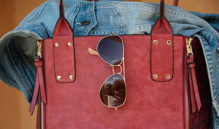 Red Leather Handbag With Sunglasses And Denim Jacket