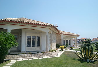 Modern Mediterranean Villa with Stone Facade and Garden