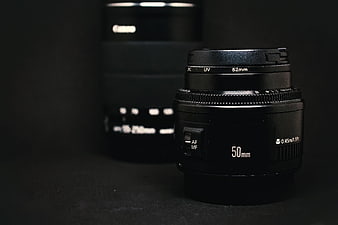 Black 50mm Camera Lens on Dark Background