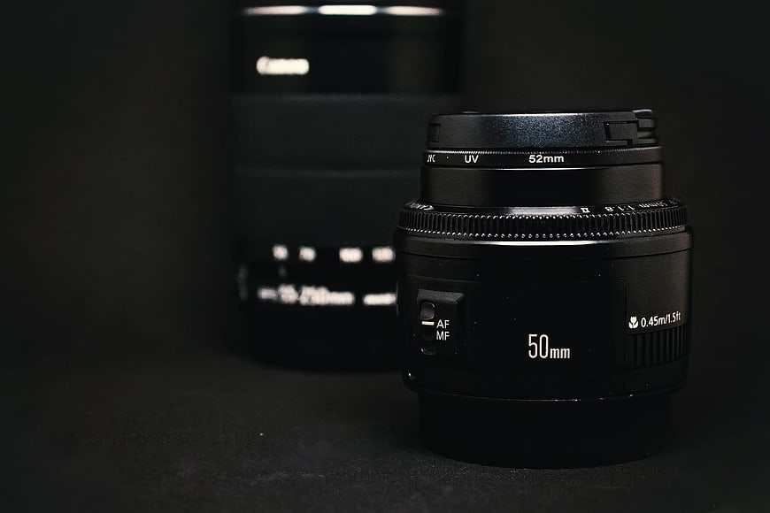 Black 50mm Camera Lens on Dark Background