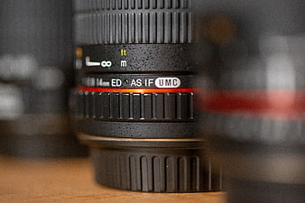 Close-up of Professional Camera Lens with Red Ring