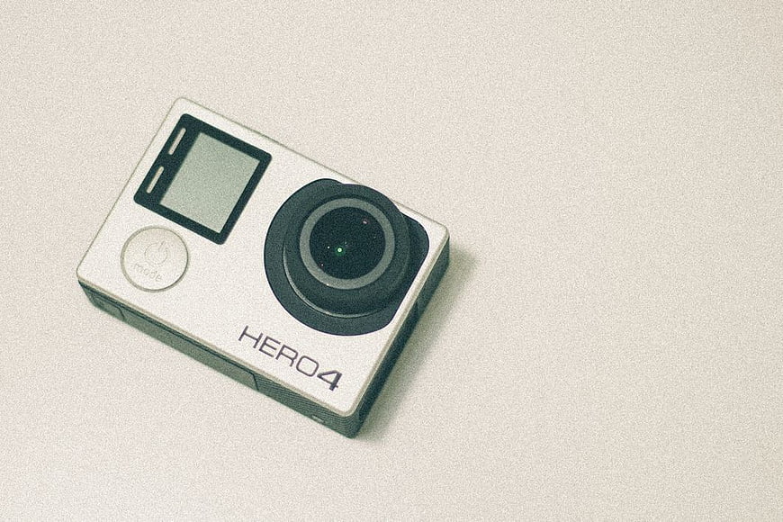 White GoPro Hero4 Action Camera on Textured Background