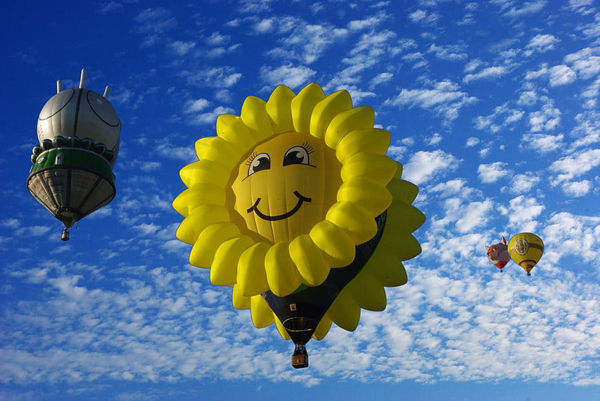 Sunflower Hot Air Balloon Flying In Blue Sky With Clouds