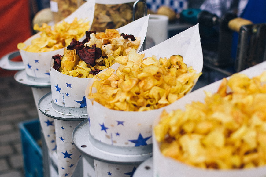 Assorted potato and beetroot chips in paper cones