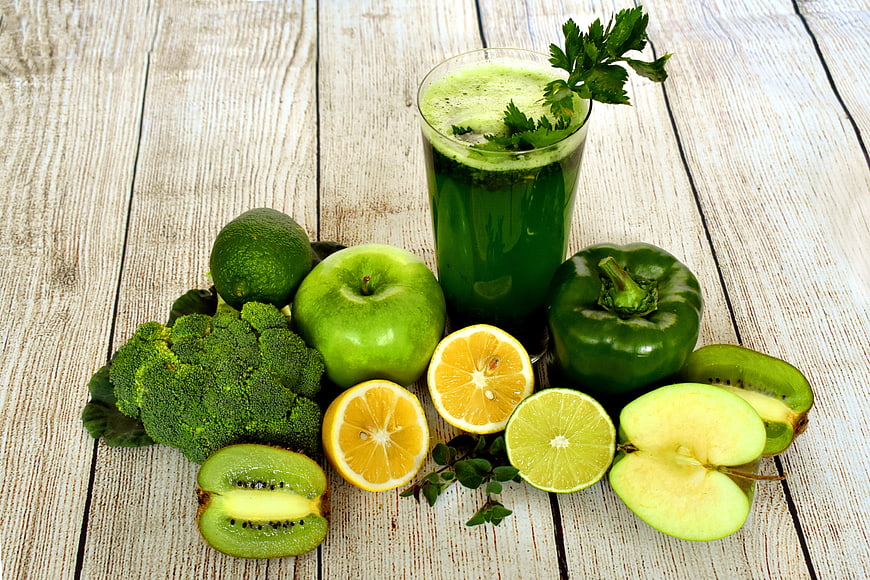 Green Detox Smoothie With Fresh Fruits And Vegetables On Rustic Wood